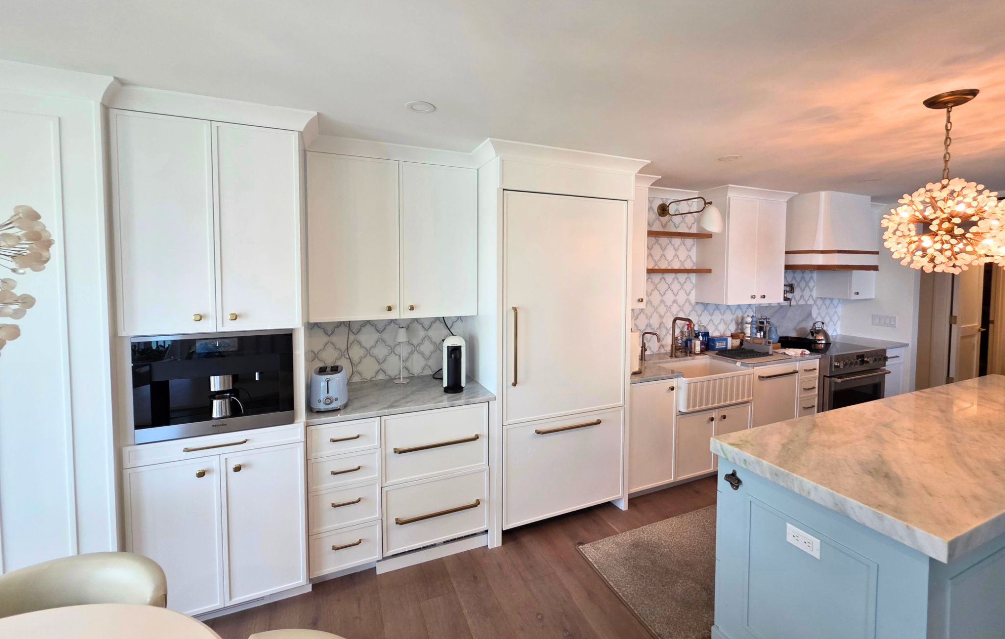 White kitchen cabinets after cabinet painting in a Gulf Shore Boulevard penthouse in Naples