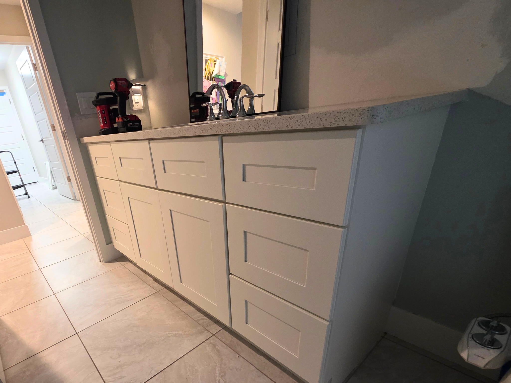 Angled view of a bathroom vanity after Alabaster cabinet painting in Southwest Cape Coral