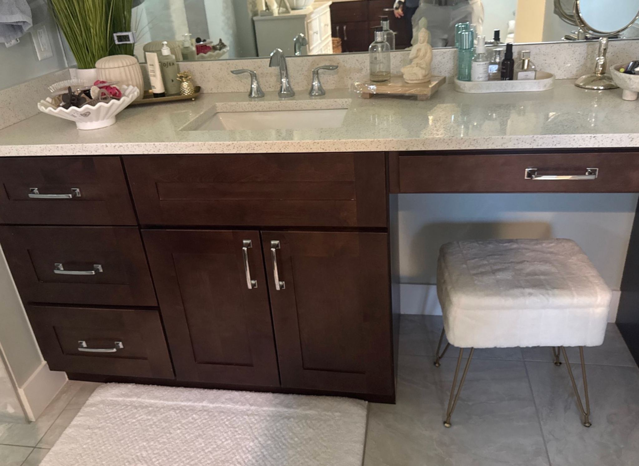 Dark bathroom vanity with a makeup area before cabinet painting in Southwest Cape Coral